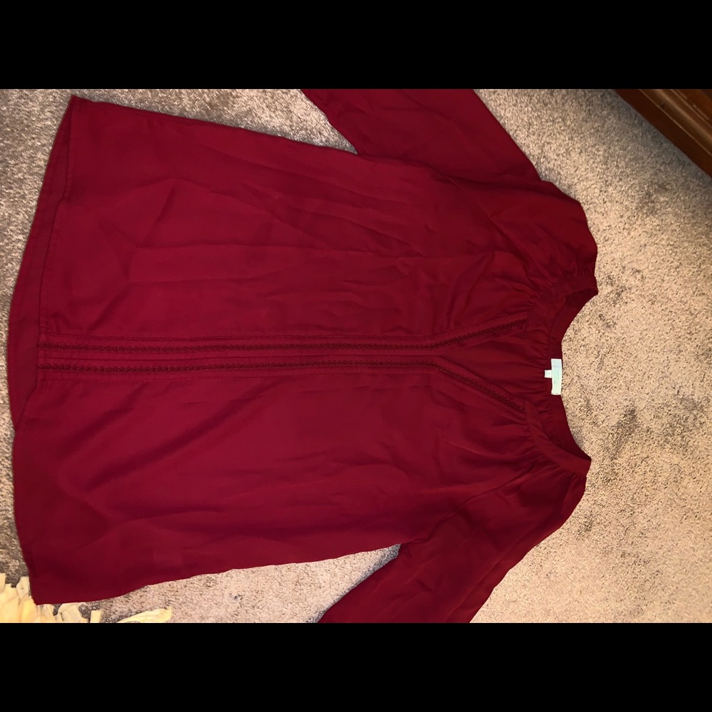 Francesca’s red dressy blouse